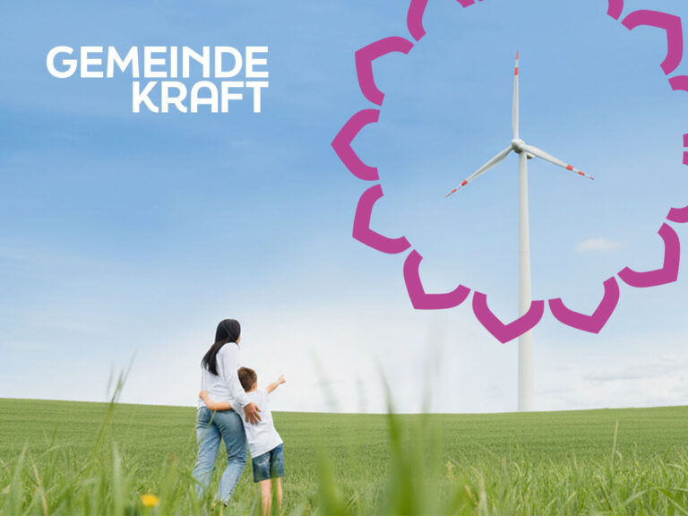 Keyvisual-Foto einer Freu mit Kind auf einer Wiese mit einem Windrad im Fokus vom "Kreis der Möglichkeiten"